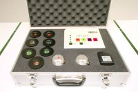 photo of theragem professional T1002 gem lamp machine in it's metal flight case with all 7 gem cups